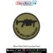 Round olive-drab tactical patch showing the black silhouette of a 38 mm Multi Shell Launcher with dark-green merrow border; available in 3-inch and 4-inch sizes with Sewn-On, Pin & Velcro (Hook) backing.