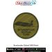 Round olive-drab patch featuring the Bombardier Global 5000 long-range business jet silhouette with black merrow border. Available in 3-inch and 4-inch sizes with Sewn-On, Pin & Velcro (Hook) backing.