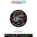 Round Metro Staff fabric patch featuring a metro station employee directing passengers on a busy railway platform with metro train, entry gates, platform signage, communication radio, and the slogan Keeping the City Moving, finished with a premium black m