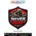 Never Quit Soldier Motivation Patch in a shield shape featuring a camouflage-clad soldier climbing over rocky mountain terrain, dramatic red sky, distressed silver NEVER lettering and bold red QUIT lettering, with black background accents and a thick blac