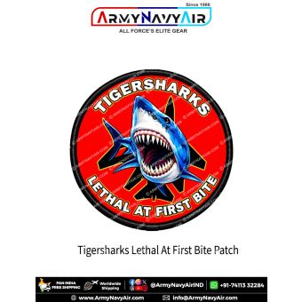 Tiger Sharks Lethal at First Bite Aviation Patch featuring a fierce blue-and-white shark with open jaws, black fighter jet silhouette, red circular background and black merrow border